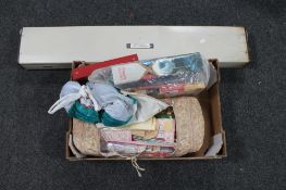 A box of knitting needles and knitting patterns,