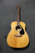 A Yamaha F-310 semi acoustic guitar