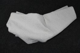 An antique hand stitched Durham quilt (white)