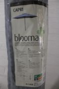 A Capri Blooma garden parasol with cover and stand