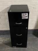 A metal three drawer filing cabinet
