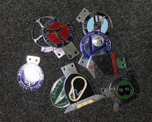 A collection of chrome car badges; Bentley Drivers Club, Rolls-Royce,
