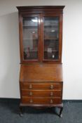 An Edwardian mahogany bureau bookcase
