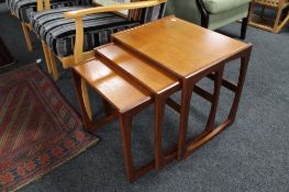 A nest of three mid century G-plan teak tables