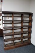 A set of Edwardian oak open bookshelves