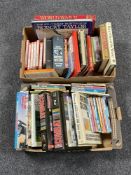 Two boxes containing hardback and paperback books,