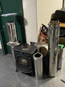 A cast iron log burner with flue (little used)