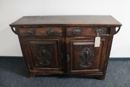 An oak Arts and Crafts double door sideboard