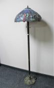 A Tiffany style standard lamp with shade
