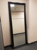 A traditional style black framed mirror,