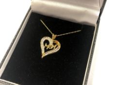 A 10ct yellow gold diamond set 'Mom' pendant on chain CONDITION REPORT: 1.