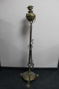 An Art Nouveau brass standard lamp