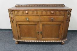 An early 20th century oak double door sideboard.