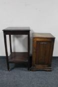 An oak linen fold pot cupboard and an Edwardian occasional table.