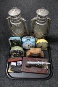 A tray of two gas lamps, mid 20th century alarm clocks, marble Art Deco clock, lighters,