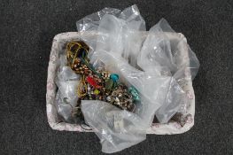 A basket of various costume jewellery