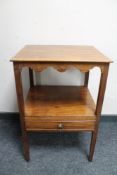 A George III mahogany side table fitted a drawer.