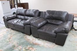 A brown leather two seater settee with armchair.