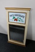 A contemporary framed hall mirror with hand painted Fry's Chocolate decoration
