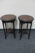 A pair of circular plant tables.