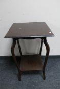 An Edwardian mahogany occasional table.