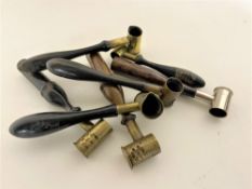 A group of antique powder grain measures