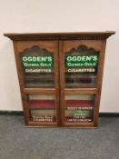 An Edwardian and later oak display cabinet 