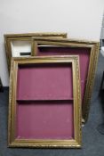 Three gilt framed display frames.