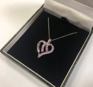 A 10ct gold diamond and pink tourmaline heart pendant on chain CONDITION REPORT: 2.