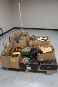 A pallet of six boxes of cooking trays, pizza paddles, mixing bowls, wooden condiment stands,