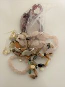 A collection of agate necklaces and cherry amber necklace