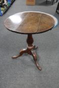A Georgian oak tripod wine table.
