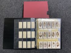 A folder in slip cover cover containing a quantity of assorted cigarette cards including John