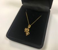 A 10ct gold diamond set heart pendant on chain