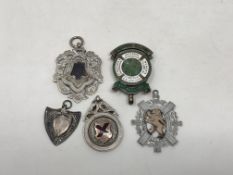 Five various silver fobs.