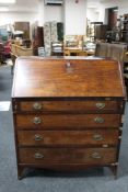 A George III mahogany bureau fitted four drawers.