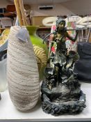 Three large vases containing two walking sticks,