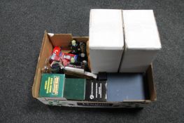 A box of three sets of golfing book ends, golf balls,