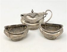 A three piece silver condiment set,