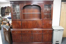 An inlaid mahogany Strongbow cocktail display unit fitted with cupboards and drawers beneath