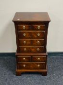 A Reprodux mahogany miniature chest,