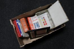 A box of mid century stamp reference books together with a box of antique and later envelopes