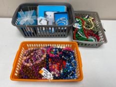 Three basket of costume jewellery, beaded necklaces,