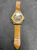 A wristwatch wall clock with strap