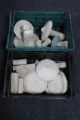 Two crates of concrete garden mushrooms