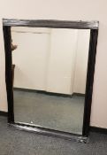 A black framed overmantel mirror,