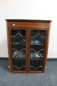 A Victorian inlaid mahogany double door cabinet