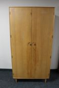 A mid 20th century Meredew Furniture compactum wardrobe