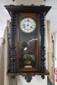 An Edwardian mahogany cased wall clock with enamelled dial