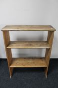 A set of antique pine open shelves